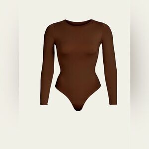 SKIMS Brown Long Sleeve Bodysuit Body-con Stretchy Raw Edge Neck Hem. NWOT